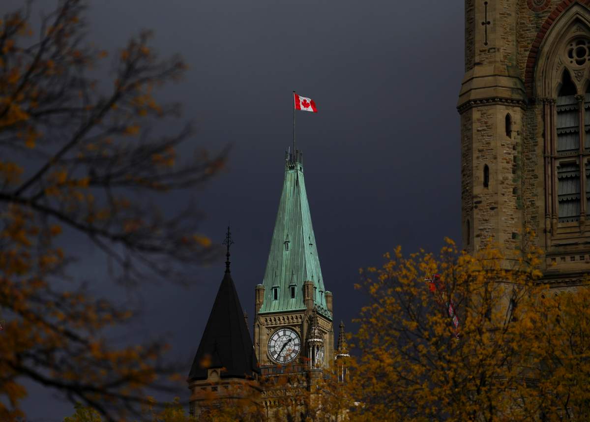 The Canadian Flag flies on the Peace Tower on Parliament Hill in Ottawa on Friday, Oct. 24, 2025.