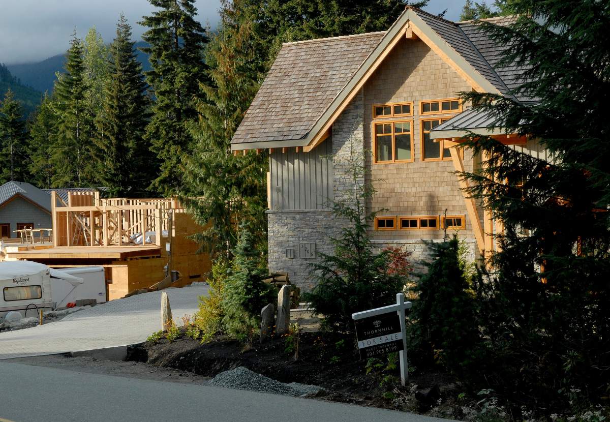 A newly-built home (at right) for sale and another under construction in the Alta Vista subdivision in Whistler, B.C. The Canadian Press Images/Don Denton