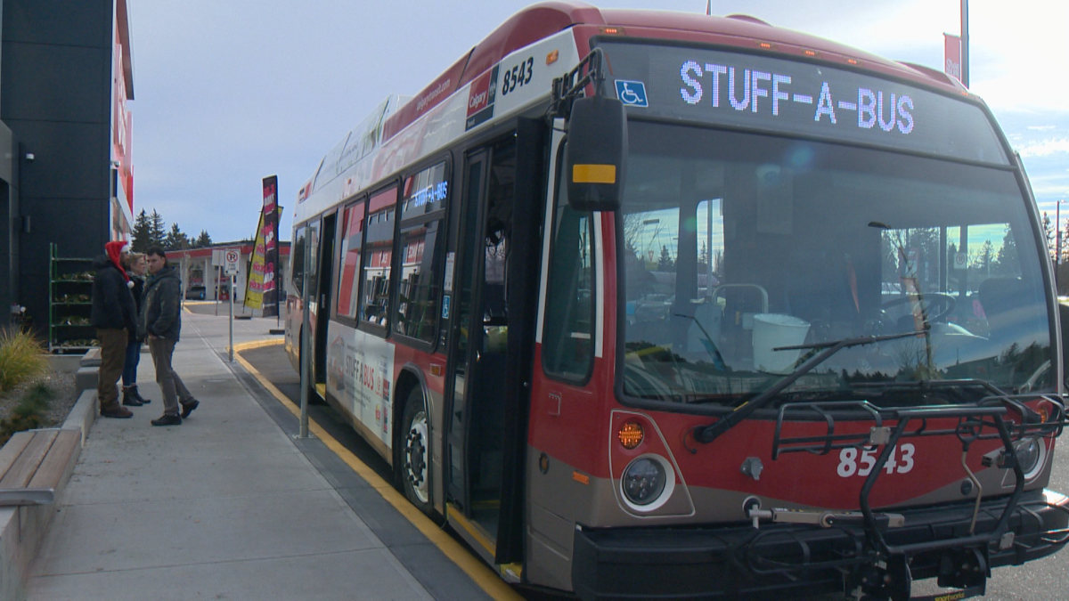 A Calgary Transit bus sits outside a grocery store