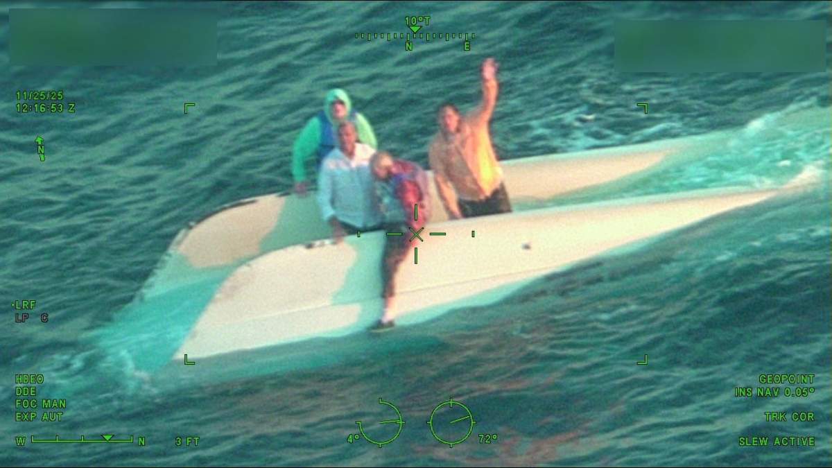 The men had been in the water atop their boat for about 20 hours before they were found by the Coast Guard.