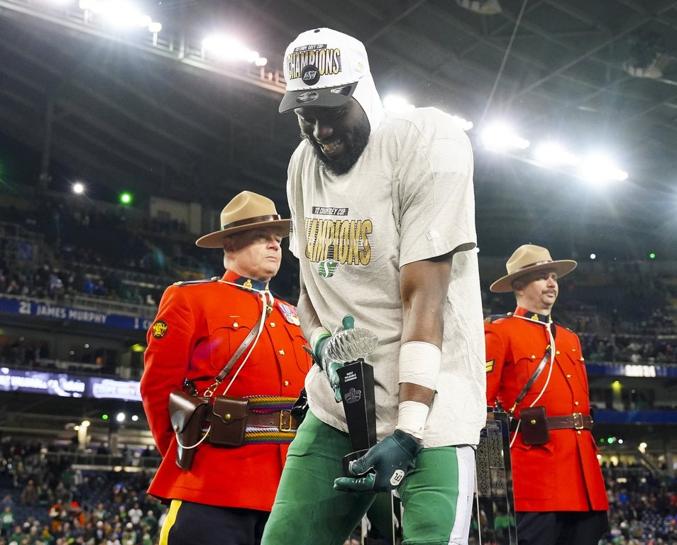 Saskatchewan Roughriders' Samuel Emilus (19) is presented with the Most Valuable Canadian after winning the 112th CFL Grey Cup against the Montreal Alouettes, in Winnipeg on Sunday, Nov. 16, 2025. THE CANADIAN PRESS/Frank Gunn.