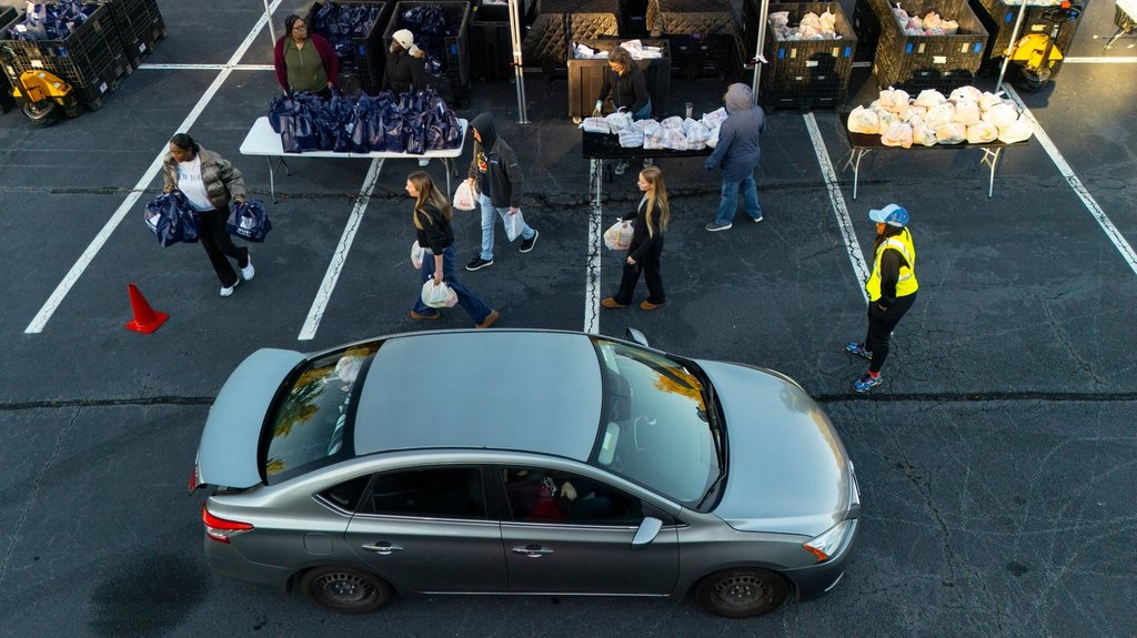 MUST Ministries delivers food to the public via a drive through service, Saturday, Nov. 1, 2025, in Austell, Ga. (AP Photo/Mike Stewart).