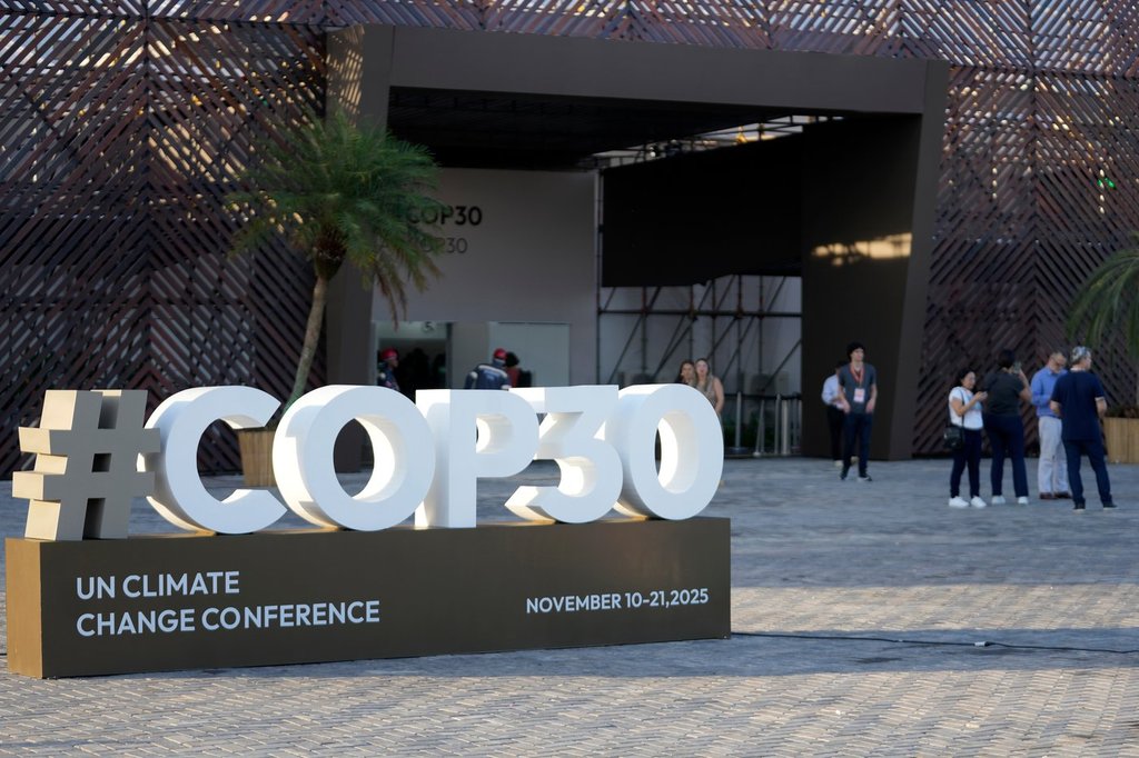 A sign for the upcoming COP30 U.N. Climate Summit sits outside of the press center in Belem, Para state, Brazil, Tuesday, Nov. 4, 2025. (AP Photo/Eraldo Peres).