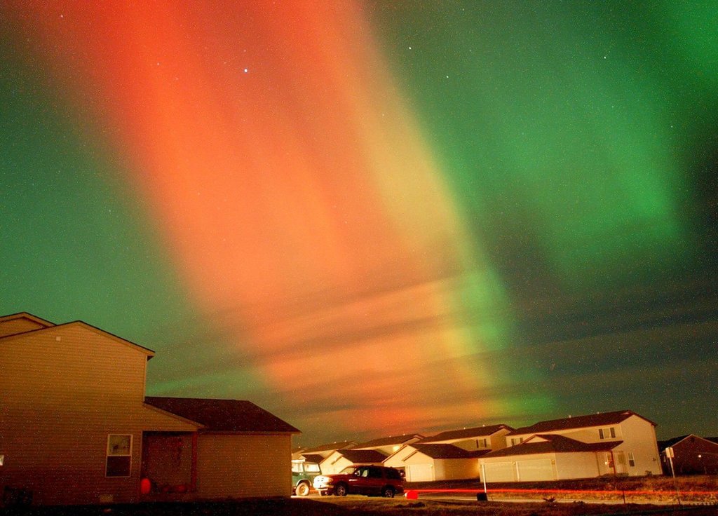 In a 30-second time exposure, the aurora borealis, or northern lights, illuminates the night sky Monday, Nov. 5, 2001, over Kalispell, Mont. The community, about five hours south of Calgary, has launched a campaign trying to woo Canadian visitors back.