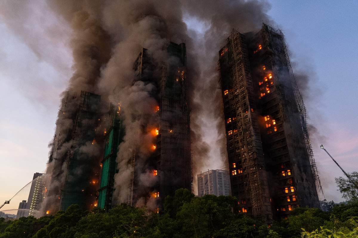 Smoke rises after a fire broke out at Wang Fuk Court, a residential estate in the Tai Po district of Hong Kong's New Territories on Wednesday, Nov. 26 2025.