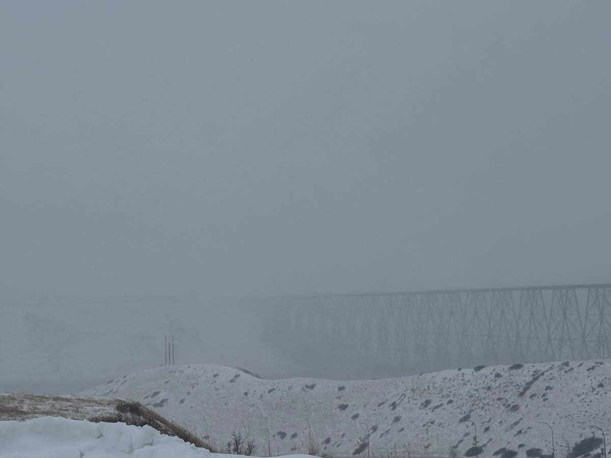 The High Level Bridge in Lethbridge is barely visible through the heavy snow on Friday morning after Environment Canada issued a heavy snowfall warning for a large part of southeastern Alberta.