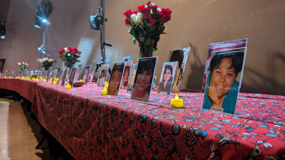 Photos of missing and murdered individuals are seen at a press conference about the Red Dress Alert program on Nov. 25, 2025.