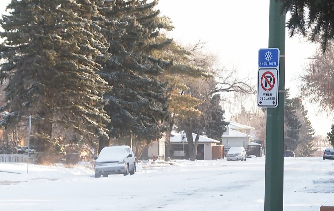 The streets that are designated as snow routes can be identified by the presence of a blue snow flakes sign mounted above parking signs in the city.