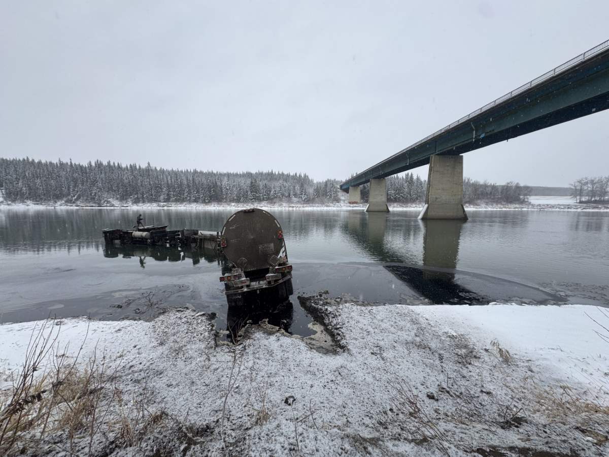A tanker trailer hauling suspected bitumen lost control on an icy highway and crashed into the North Saskatchewan River near Waskatenau, downstream of Edmonton, on Thursday, Nov. 6, 2025.