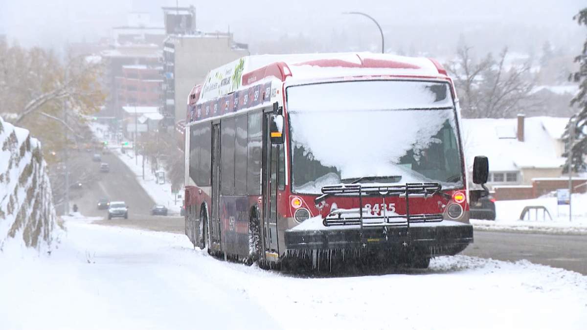 A Calgary Transit bus is seen stranded on the side of the road after being unable to navigate a hill in the Panorama neighbourhood during a snowstorm during the winter of 2023.