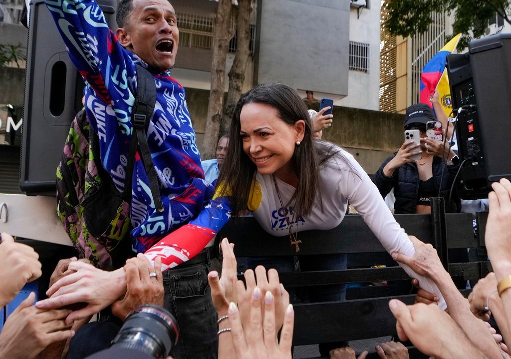 FILE – Opposition leader Maria Corina Machado greets supporters during a protest against Venezuelan President Nicolas Maduro the day before his inauguration for a third term in Caracas, Venezuela, Thursday, Jan. 9, 2025. (AP Photo/Matias Delacroix, file)