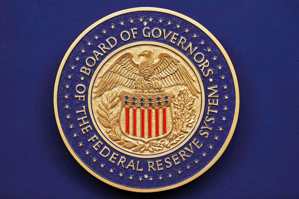 FILE - A seal is seen before Federal Reserve Chairman Jerome Powell walks out to speak during a news conference following the Federal Open Market Committee meeting, Sept. 17, 2025, at the Federal Reserve Board Building in Washington. (AP Photo/Jacquelyn Martin, File).