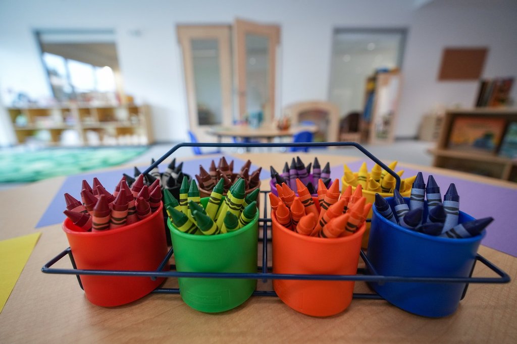 Crayons are seen on a table at a childcare facility, in North Vancouver, B.C., on Thursday, July 3, 2025. THE CANADIAN PRESS/Darryl Dyck.