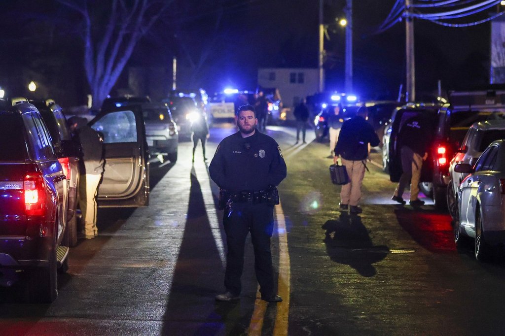 Law enforcement officers are seen outside a storage facility where a suspect in the shooting at Brown University was found dead, Thursday, Dec. 18, 2025, in Salem, N.H. (AP Photo/Reba Saldanha).