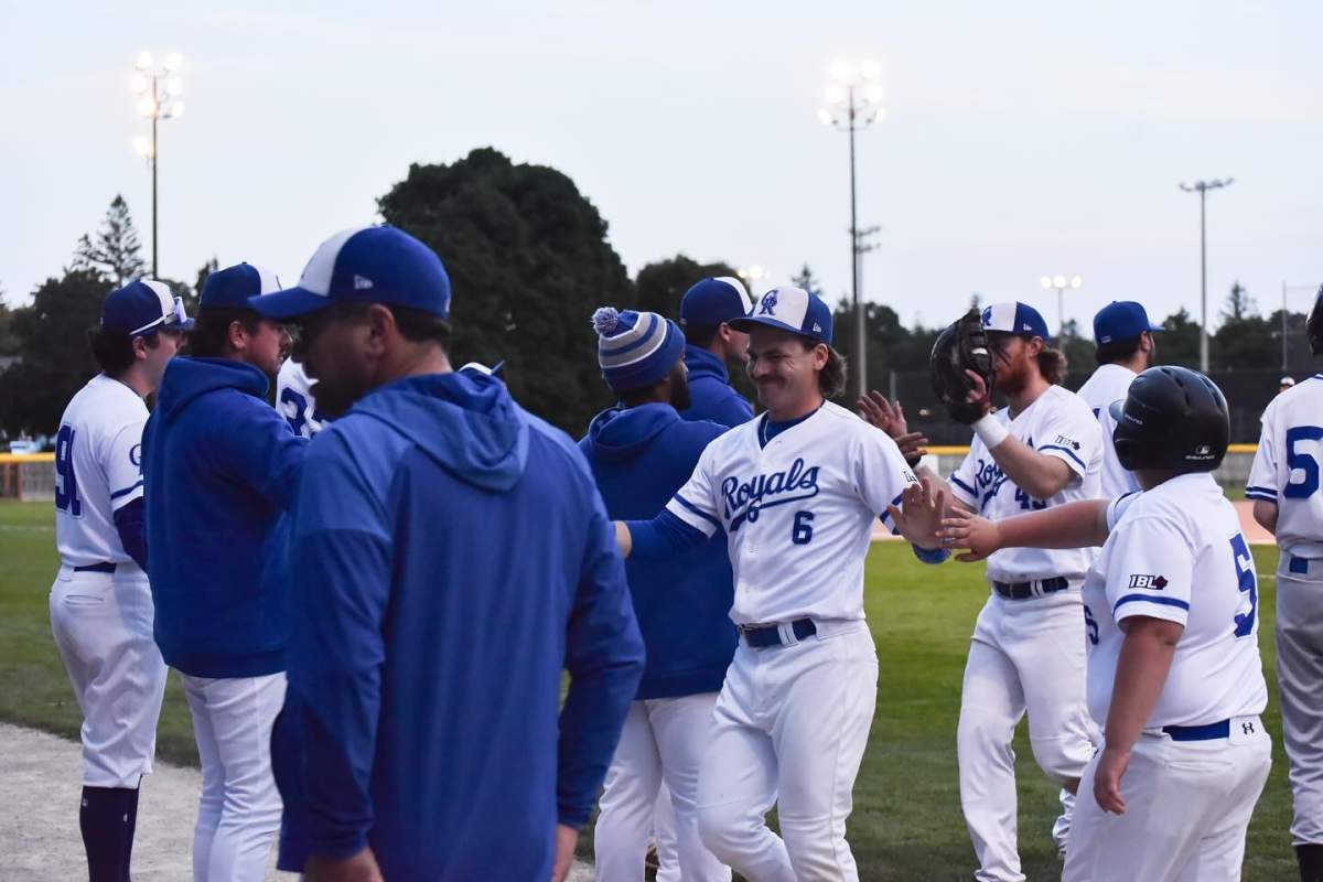 Members of the Guelph Royals gather on the field during a home game