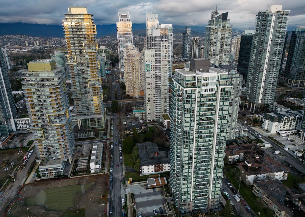Condo buildings tower above older two and three-storey walk-up apartment buildings in Burnaby, B.C., on Wednesday, Dec. 18, 2024. THE CANADIAN PRESS/Darryl Dyck.