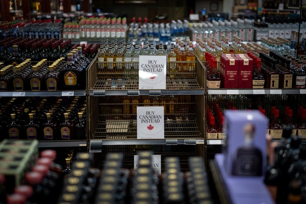 Various American-made spirits and wines will be available to purchase by the general public in Manitoba for a short period of time. A sign is placed in front of the American whiskey section at a B.C. Liquor Store after top selling American made products have been removed from shelves in Vancouver, B.C., Sunday, Feb. 2, 2025. THE CANADIAN PRESS/Ethan Cairns.
