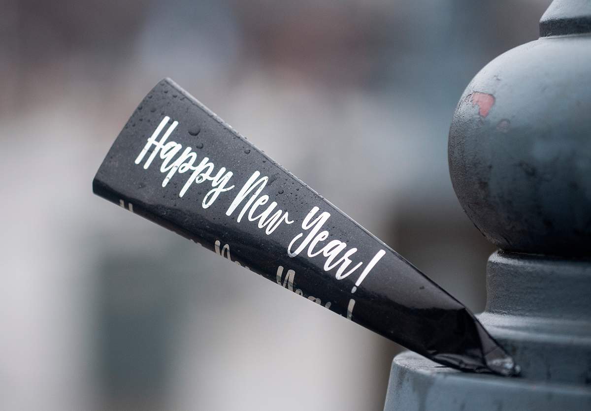 The words Happy New Year are shown on a piece of a plastic casing on New Year's Day in Montreal, Sunday, January 1, 2023. 