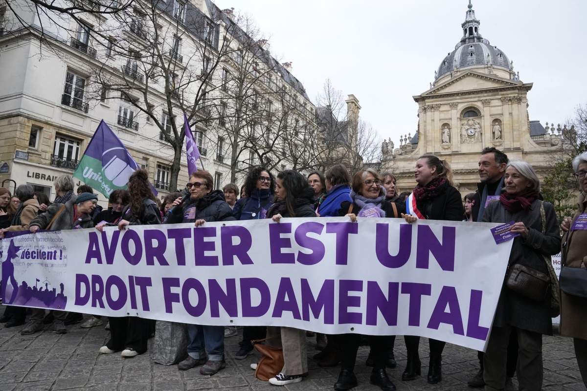 FILE - Pro-abortion rights activists hold banner reads 'abortion is a fundamental right' during a rally for abortion rights outside La Sorbonne university in Paris, on Feb. 28, 2024. (AP Photo/Michel Euler, File).