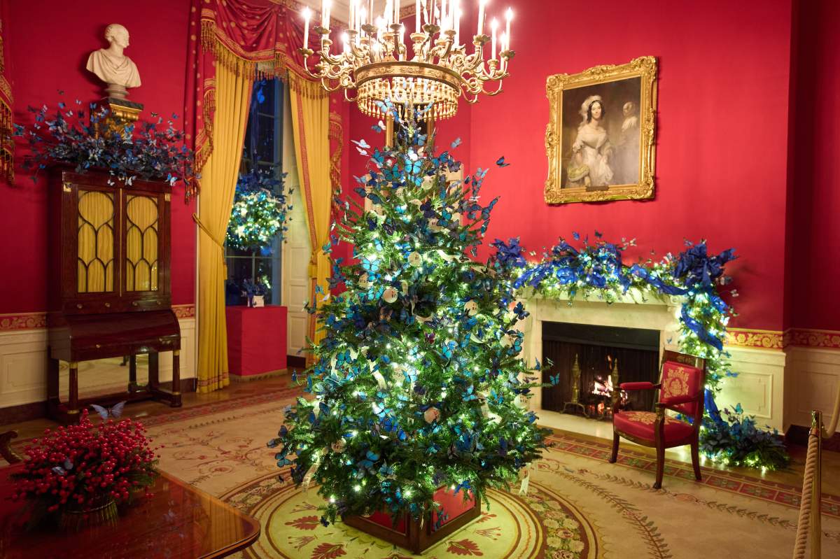 A Christmas tree decorates the Red Room of the White House during a press preview of the Christmas decorations 'Home is Where the Heart Is,' Monday, Dec. 1, 2025, in Washington.