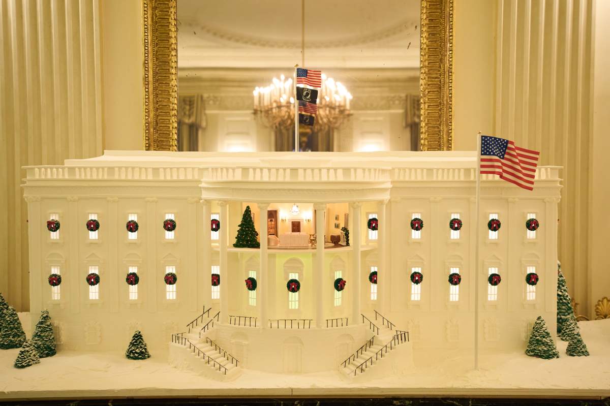 A Ginger Bread House decorates the State Dining Room of the White House during a press preview of the Christmas decorations 'Home is Where the Heart Is,' Monday, Dec. 1, 2025, in Washington.