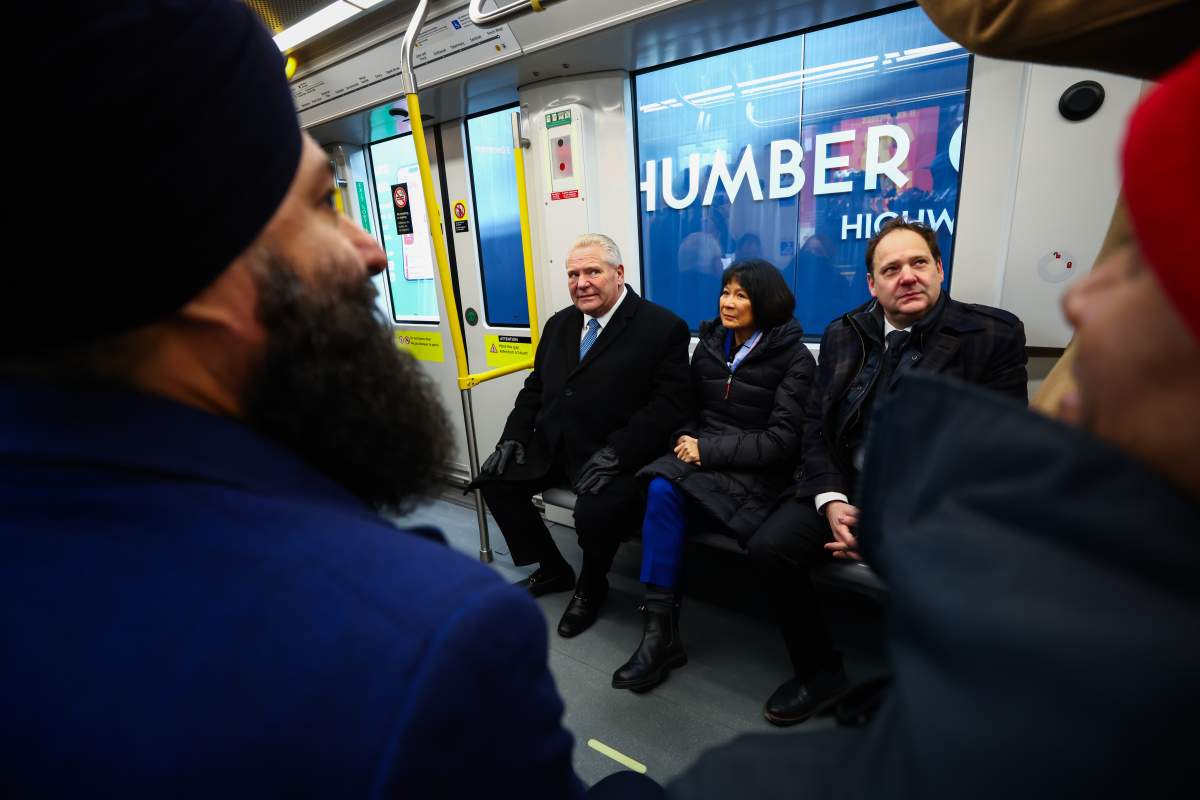 Ontario Premier Doug Ford rides the newly unveiled Finch LRT train in Toronto alongside Toronto Mayor Olivia Chow and federal Minister John Zerucelli, during the unveiling of the new LRT transit line in Toronto, Friday, Dec. 5, 2025.