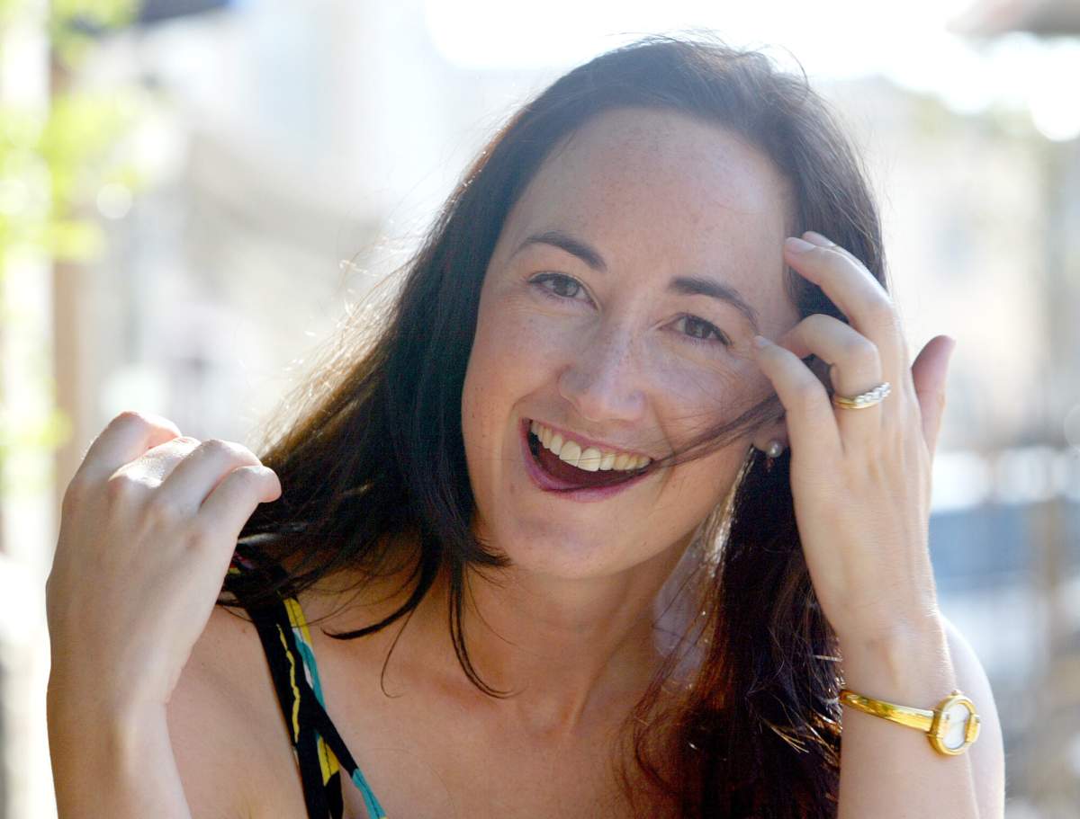 Author Sophie Kinsella poses on Wimbledon Village high street, London, Sept. 9, 2004.