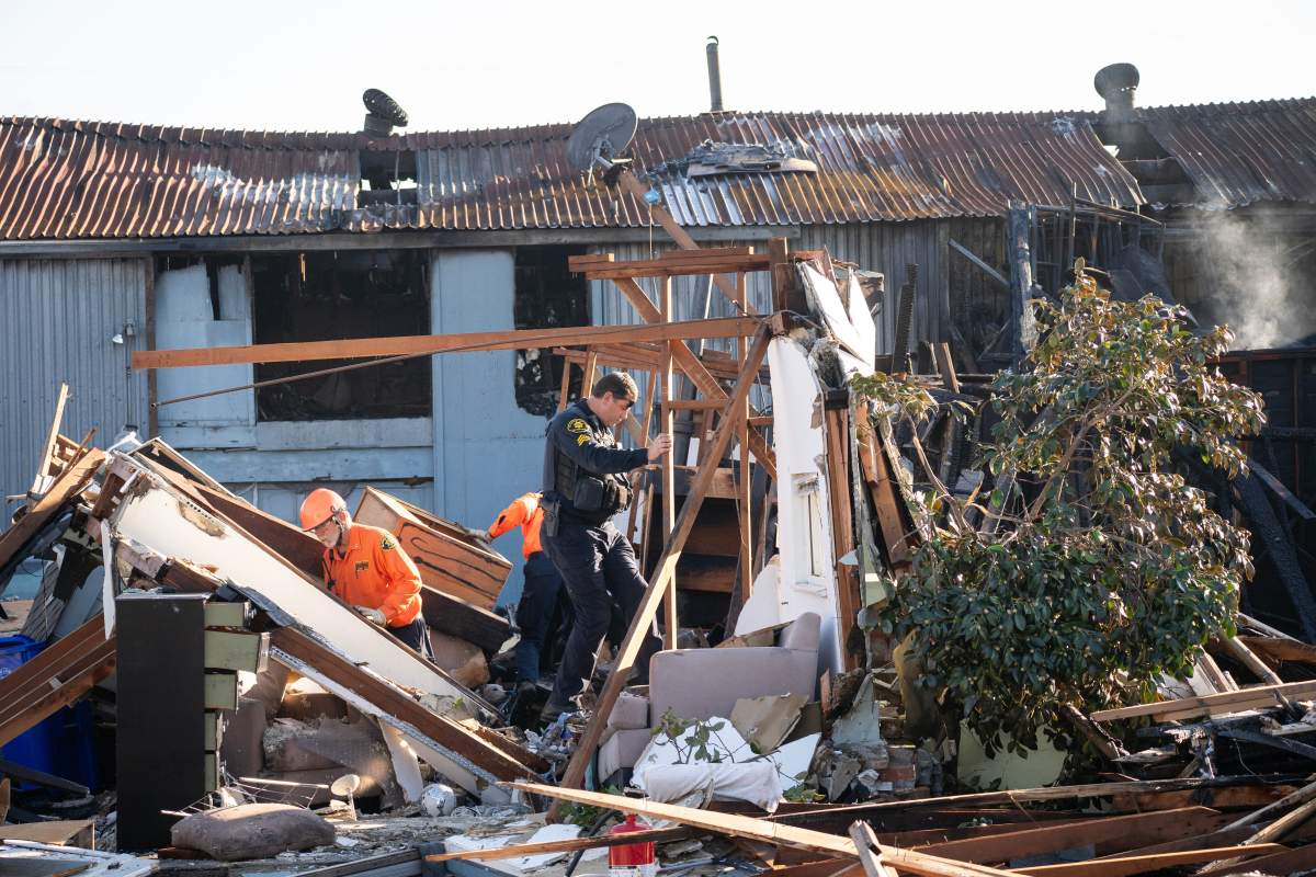 Alameda County Police Officers and Search and Rescue access the aftermath at the site of the explosion on the 800 block of East Lewelling Boulevard, Thursday, Dec. 11, 2025, in Hayward, Calif.
