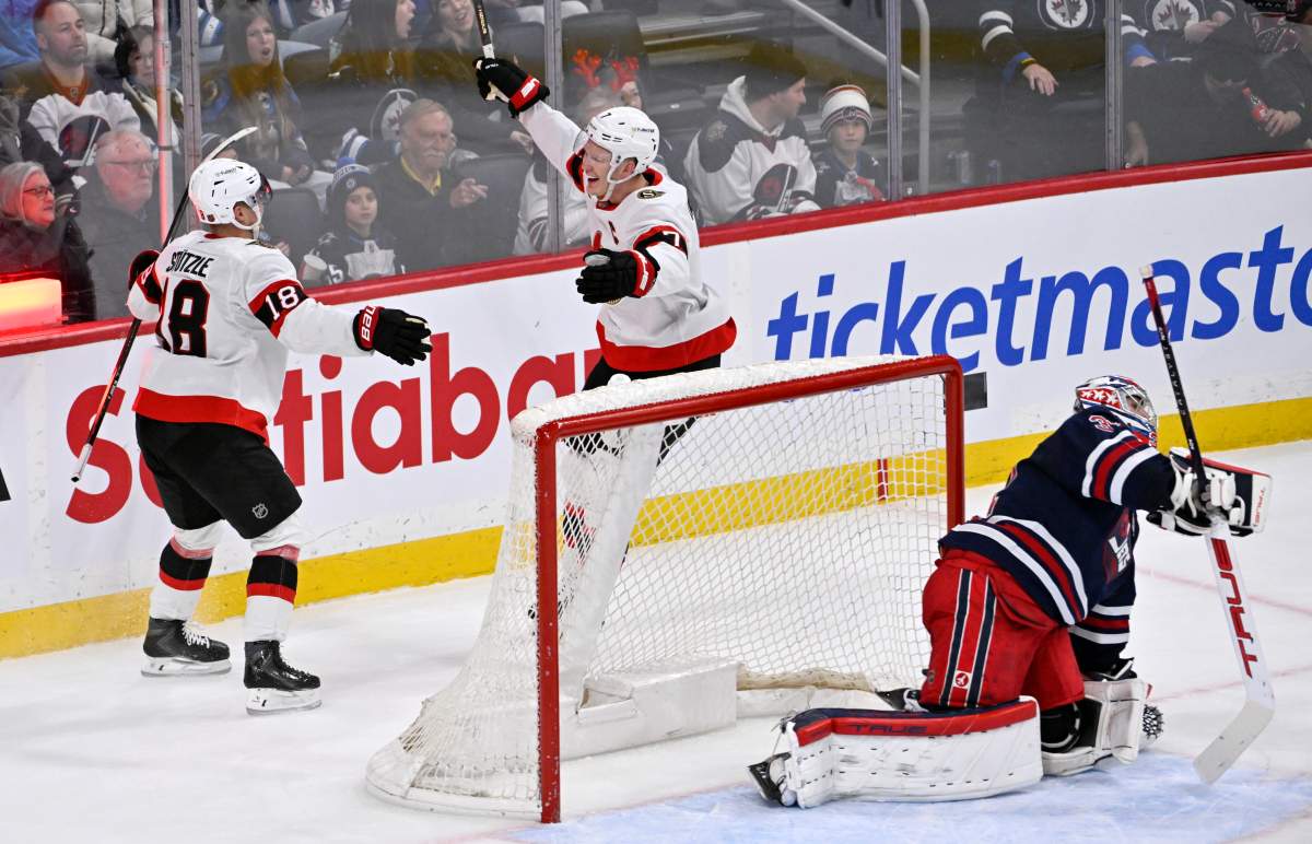 Ottawa Senators' Brady Tkachuk (7) celebrates his game-winning goal in overtime against Winnipeg Jets' goaltender Connor Hellebuyck (37) with Tim Stulzle (18) during their NHL hockey game in Winnipeg, Monday, Dec. 15, 2025. THE CANADIAN PRESS/Fred Greenslade.