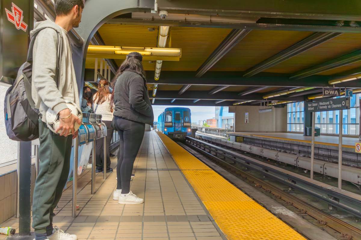 Riders wait for an LRT train at a transit station in Toronto's east end on May 23, 2022. The Scarborough line was permanently shut down after a derailment in July 2023.