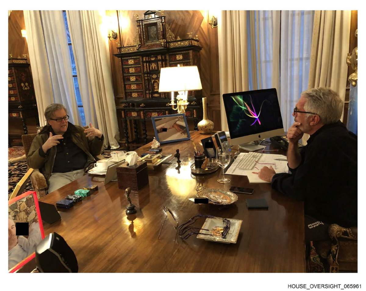 Epstein and Steve Bannon sitting at a desk.
