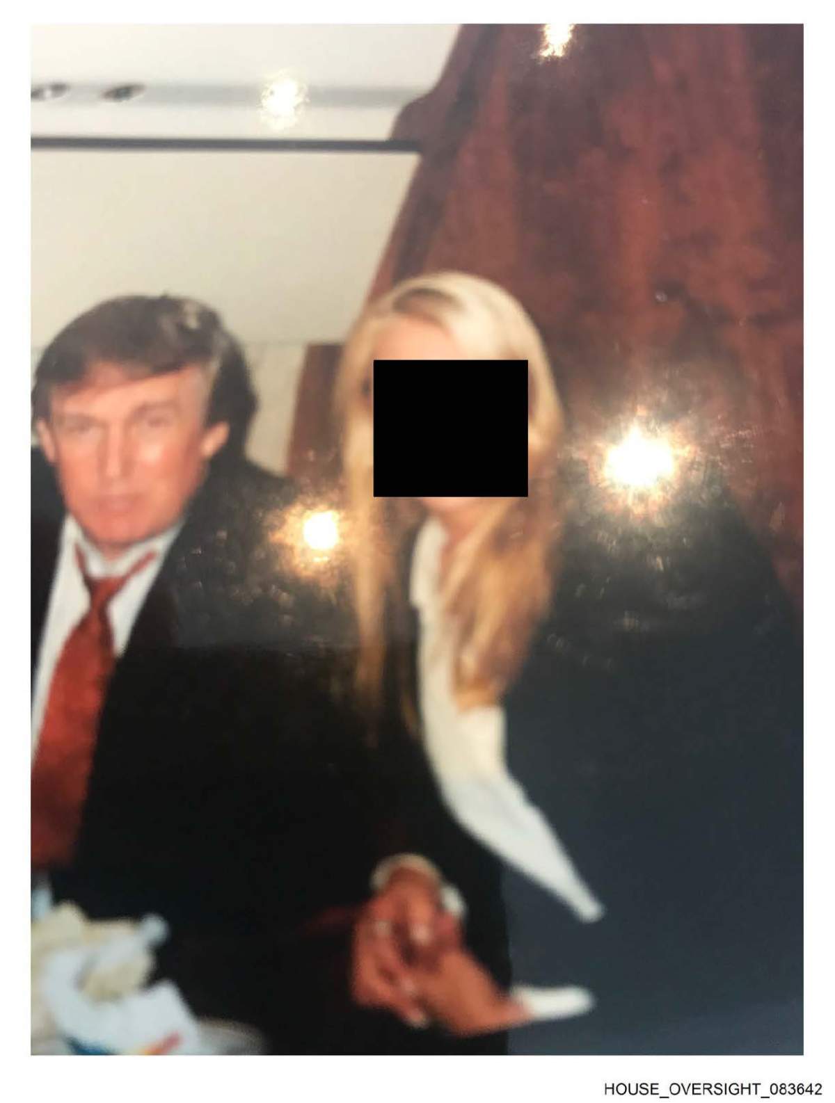 Trump and an unidentified woman.