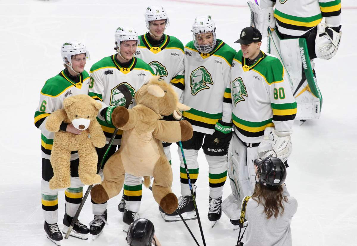 A few members of the London Knights pose for a picture on Teddy Bear Toss night at Canada Life Place on Dec. 3, 2025