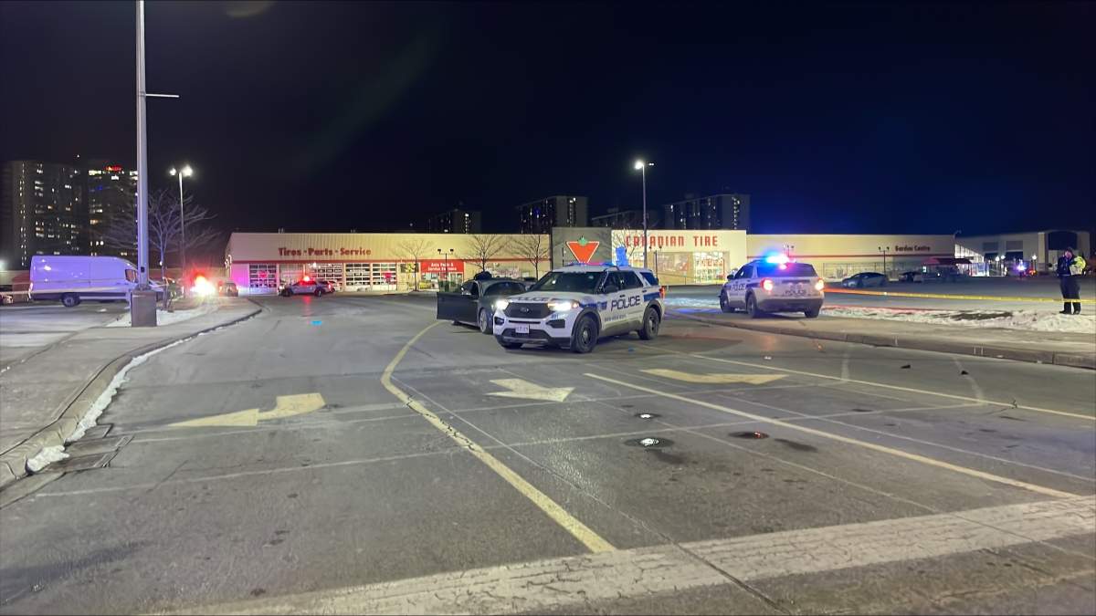 Police at the scene following a fatal shooting at Shoppers World Brampton parking lot.