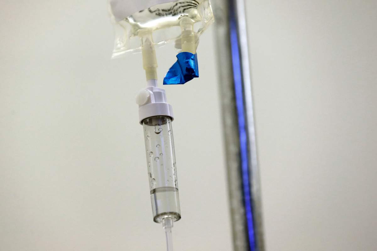 FILE - In this May 25, 2017 file photo, chemotherapy drugs are administered to a patient at a hospital in Chapel Hill, N.C.