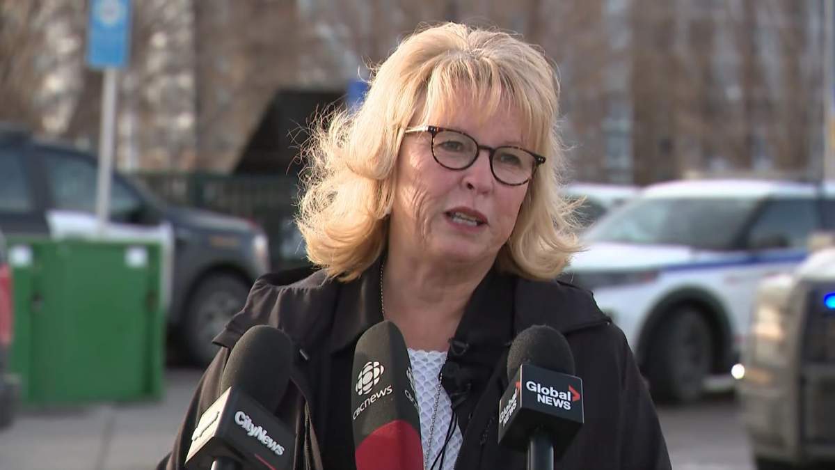 Calgary police Chief Katie McLellan answers questions from the media at a Tuesday afternoon press conference outside the Brentwood LRT station.