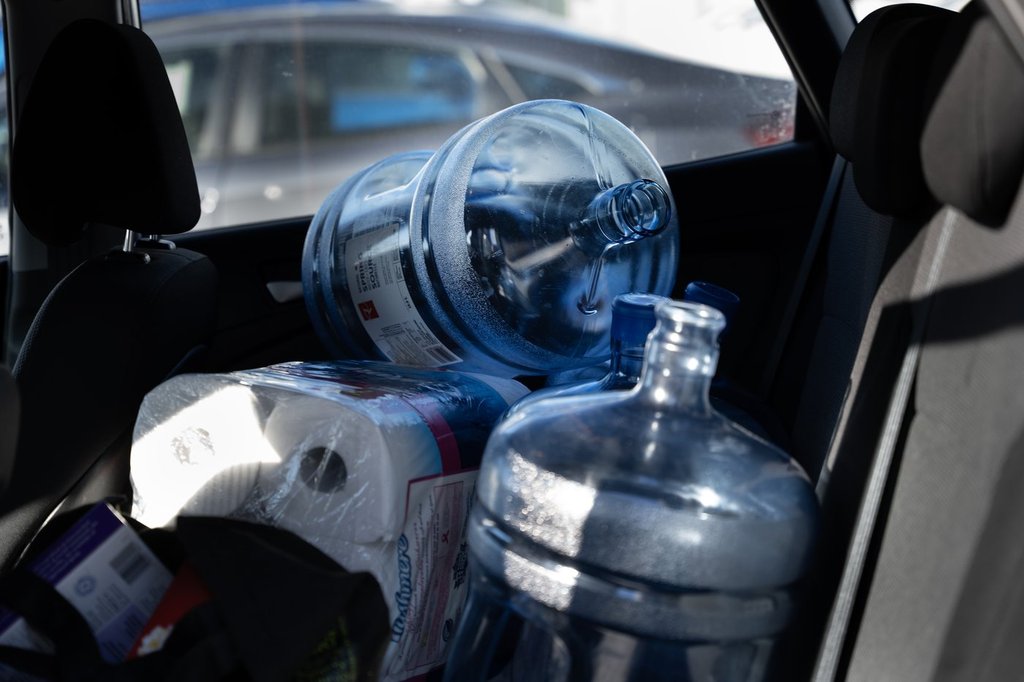 Water jugs are seen loaded in a car as residents living in the Halifax region are being asked to boil water for one minute before consumption on Tuesday, Jan. 21, 2025. 