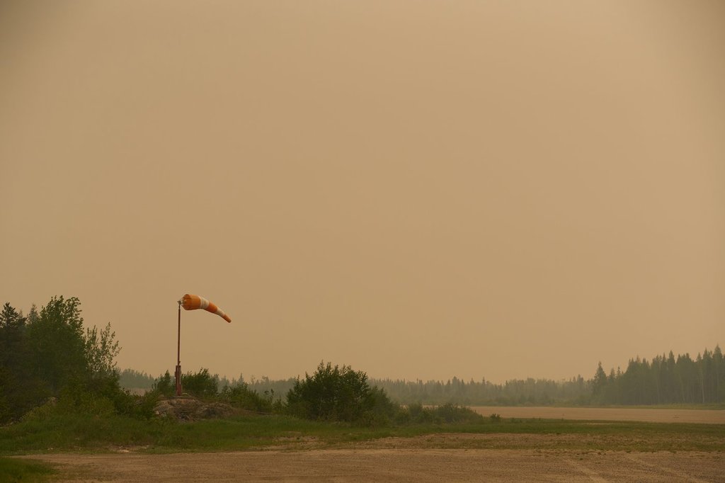 Smoke-filled skies from out of control wildfires in Norway House, Man., Tuesday, June 3, 2025, at the Norway House Airport as crews continue to fight wildfires in northern Manitoba. ski