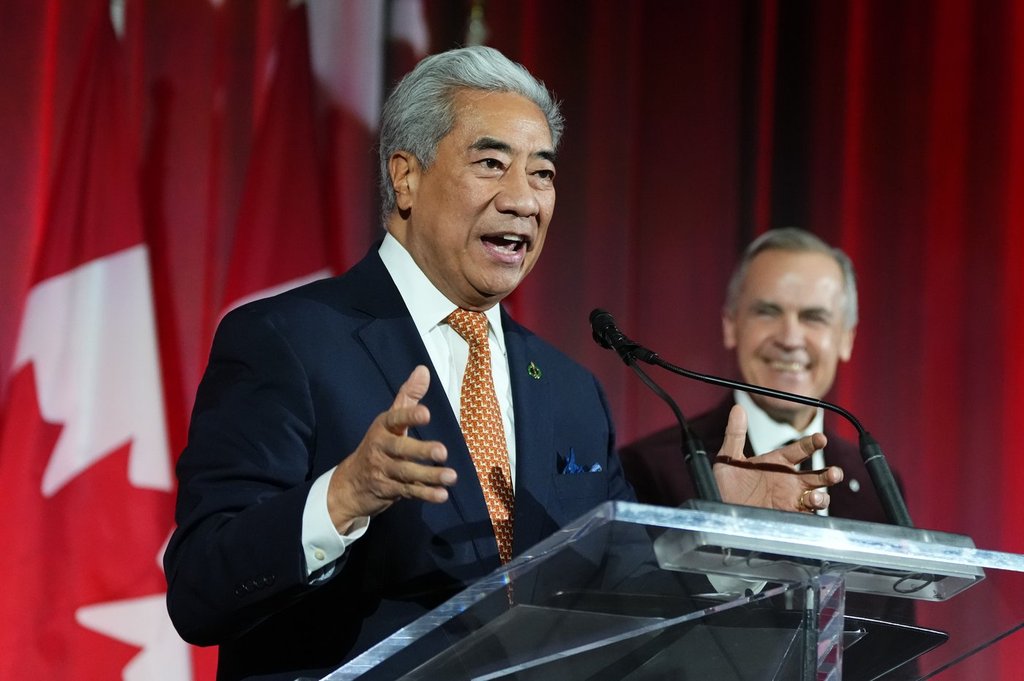 Michael Ma, member of Parliament for Markham-Unionville, makes brief remarks alongside Prime Minister Mark Carney at the Liberal caucus holiday party in Ottawa on Thursday, Dec. 11, 2025.