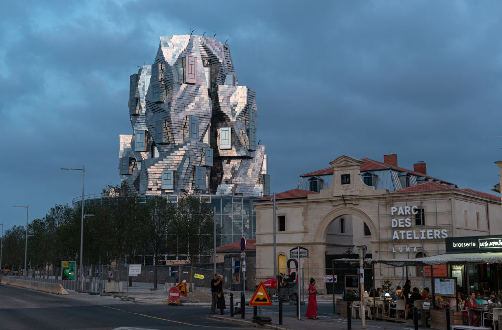 The LUMA Arles Cultural Center, designed by architect Frank Gehry, is a 56-meter-high, shiny tower.