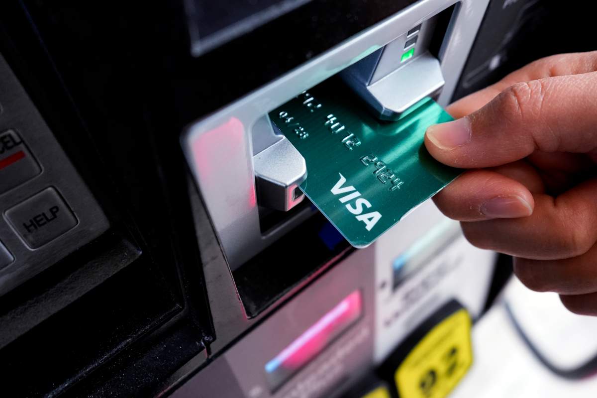 A customer uses a Visa credit card to pay for gasoline at a gas station in Mundelein, Ill., Thursday, Feb. 8, 2024.
