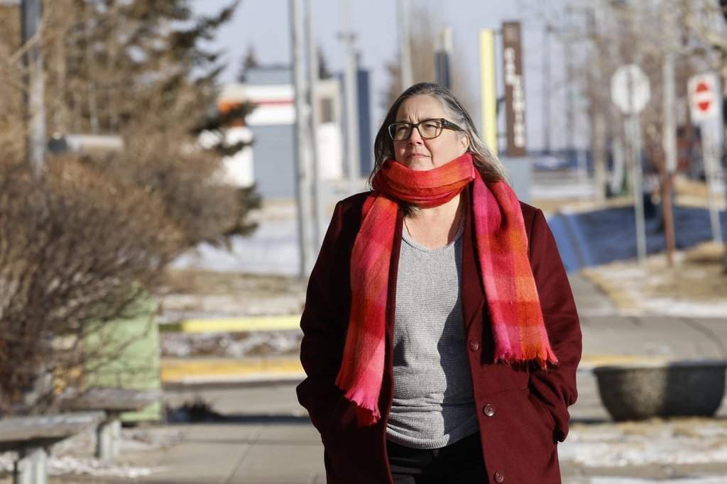 Colleen Whitley walks to a hospital to visit her mother in Calgary, Friday, Jan. 23, 2026.