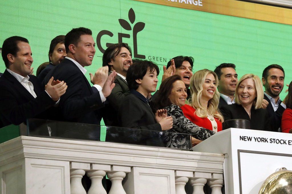 Executives and guests of GFL Environmental Inc., ring the New York Stock Exchange opening bell, in celebration of the company's Initial Public Offering, Wednesday, March 4, 2020. (AP Photo/Richard Drew).
