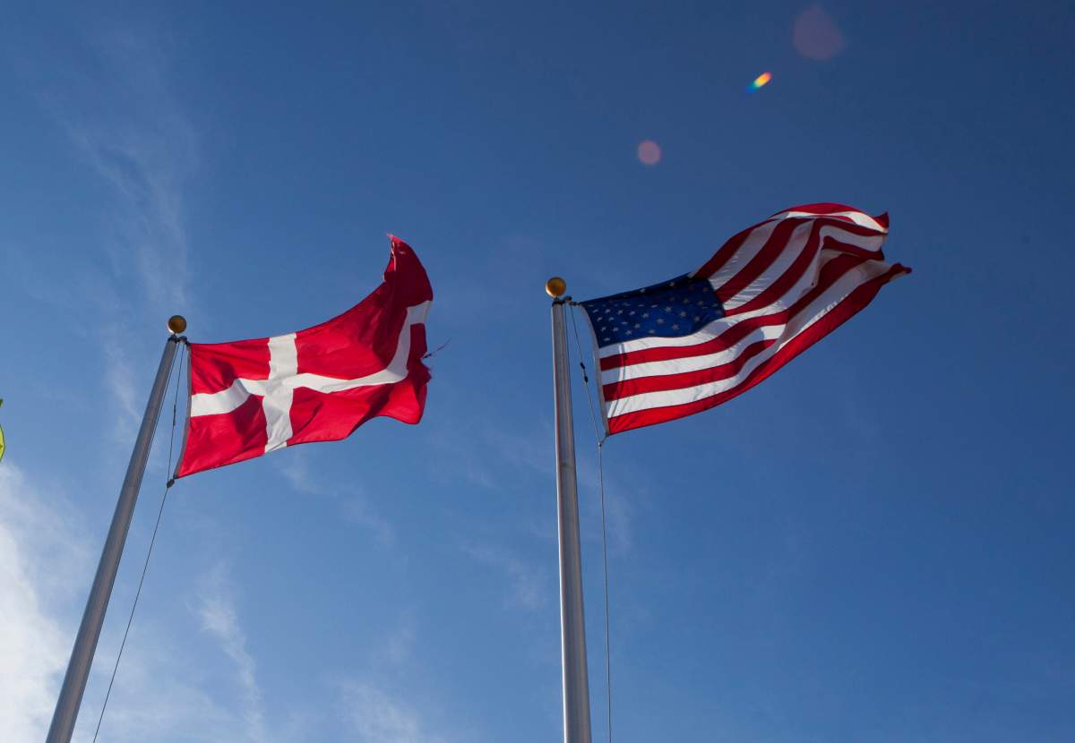 FILE -In this photo taken Nov. 17, 2011, the U.S. and Danish flags fly at the Novozymes new enzyme plant under construction near Blair, Neb. (AP Photo/Nati Harnik, File).