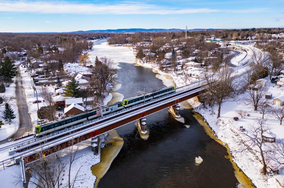An aerial view of the REM train travelling from Ile Bigras on the Deux Montagne line in Laval, Que., on Friday, Dec. 12, 2025.