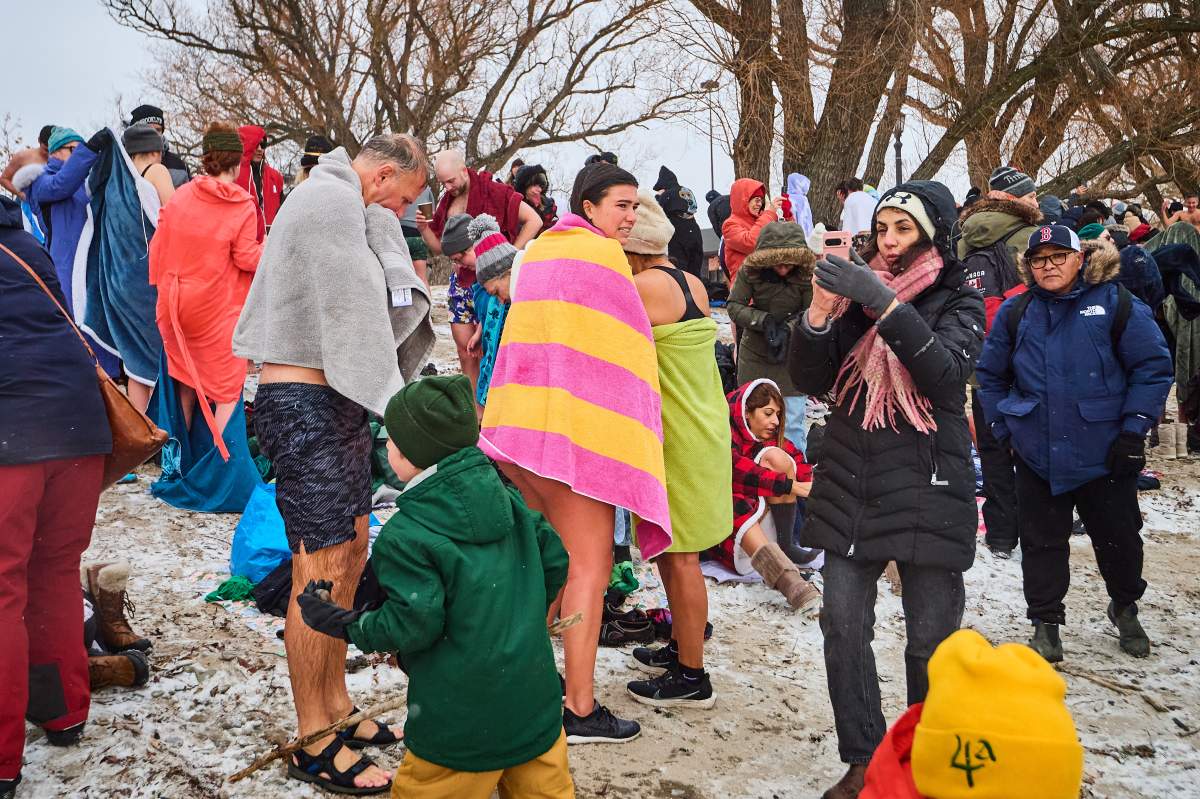 People dry off after taking part in a New Year’s Day polar bear dip at Sunnyside beach in Toronto, on Thursday, Jan. 1, 2026. THE CANADIAN PRESS/Sammy Kogan