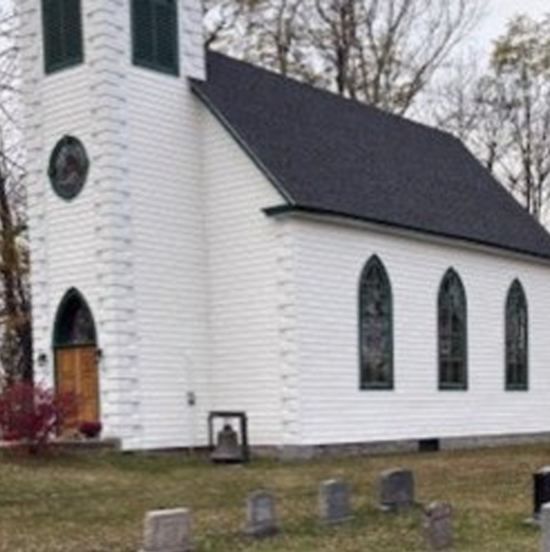 A large brass bell that Fredericton police say was stolen from St. Peter’s Anglican Church in Fredericton, on Monday, Dec. 29, 2025, is shown in front of the church, in this undated handout photo. 