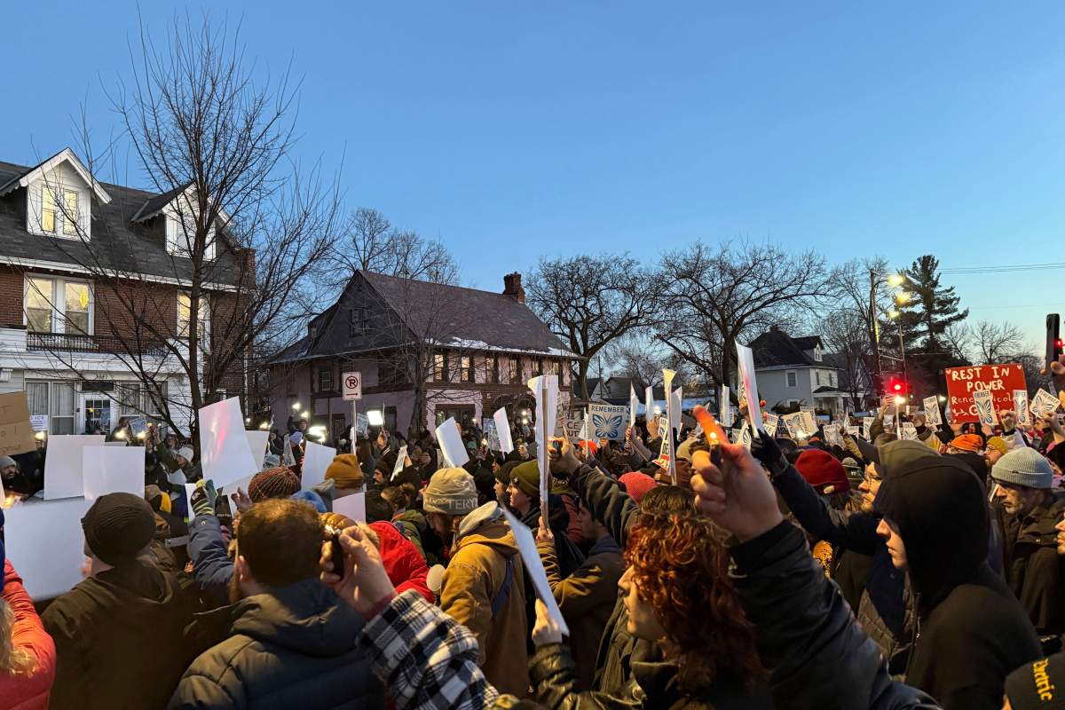 Demonstrators gather during a vigil near where an Immigration and Customs Enforcement officer shot and killed a woman in Minneapolis, Wednesday, Jan. 7, 2026.
