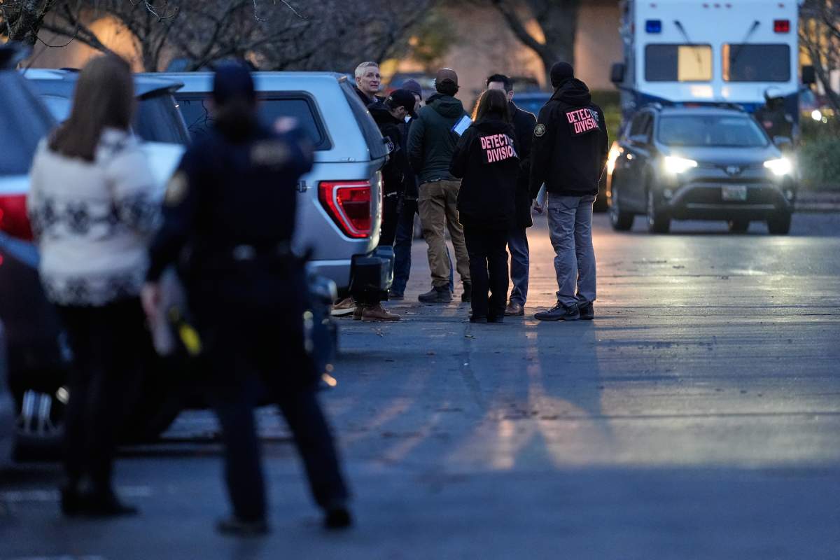 Law enforcement officials work the scene following reports that federal immigration officers shot and wounded people in Portland, Ore., Thursday, Jan. 8, 2026.