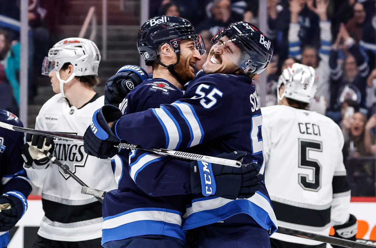 Winnipeg Jets' Mark Scheifele (55) and Gabriel Vilardi (13) celebrate Scheifele's goal against the Los Angeles Kings during second period NHL action in Winnipeg, Friday, January 9, 2026. THE CANADIAN PRESS/John Woods.